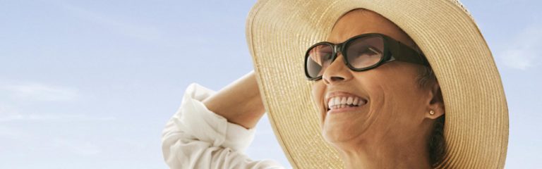 Women in sunglasses protecting herself from harmful UV 