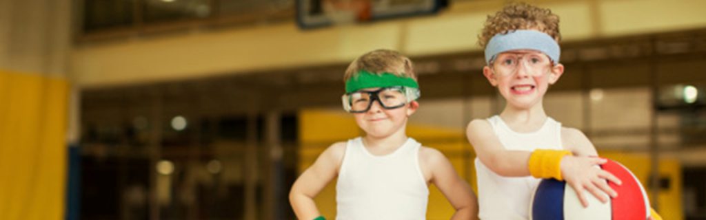 Two boys in eye protective gear with basketball